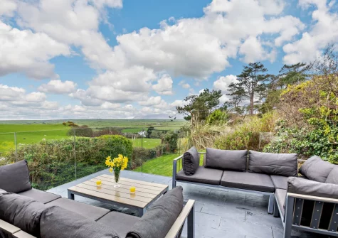 The patio, barbecue & outdoor sitting area at Ty'n Y Mur Cottage, Abersoch