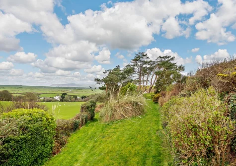 The very large enclosed rear garden at Ty'n Y Mur Cottage, Abersoch