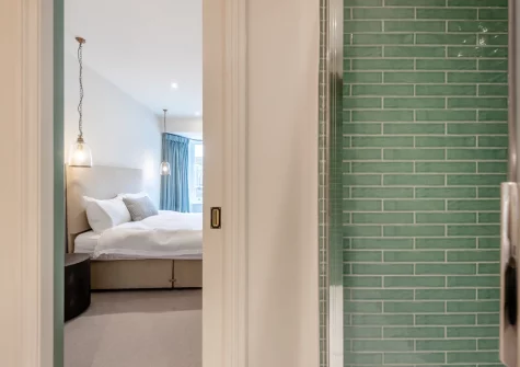 Bedroom #1 & en-suite shower room at Vine Cottage, Tenby