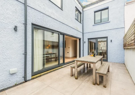 The courtyard garden & alfresco dining area at Vine Cottage, Tenby
