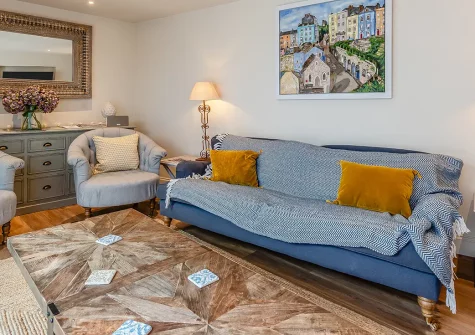 Vine Cottage, Tenby is a charming Grade II-listed four-bedroom retreat in the historic town centre, blending Victorian elegance with modern comfort. Enjoy stylish interiors, a delightful courtyard garden, and golden beaches just moments away.