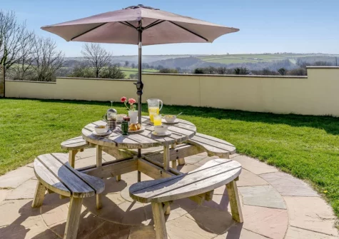 The patio, alfresco dining area & enclosed garden at Wilwin, Maenclochog