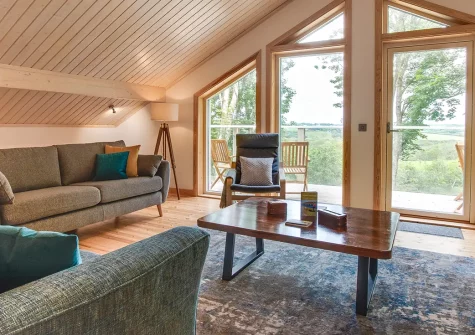 Woodland View, Trefloyne Manor, Penally is a stunning 3-bedroom woodland lodge with panoramic views, glass-fronted balcony, and on-site spa. Perfect for families seeking tranquillity near Pembrokeshire's finest beaches and Tenby's charm.