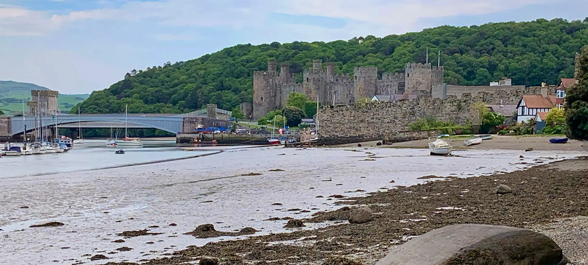 Conwy Castle's dark, brooding presence is no accident. When King Edward I built Conwy Castle in the late 13th century it was intended to dominate and intimidate – and it's still doing its job, competing with Snowdonia's rugged skyline and winning the battle for our attention. Is there another castle in Wales that evokes the atmosphere of medieval times so well? We don't think so...And we think you'll agree when you clamber up to the towers that seem to spring naturally from the dark rock on which they were built.