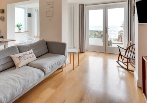 Wren Cottage, Saundersfoot is a spectacular five-bedroom beachside home sleeping ten, boasting panoramic sea views, two lounges, a balcony sunroom, terraced gardens with direct beach access, and Pembrokeshire's coastal treasures on the doorstep.