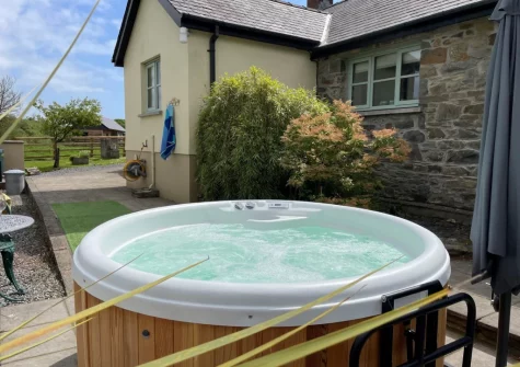 The rear patio & hot tub at Y Beudy, Clynderwen