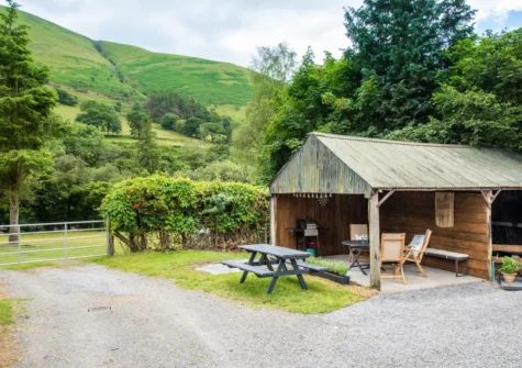 The covered patio, barbecue & alfresco dining area at Y Felin, Llanymawddwy