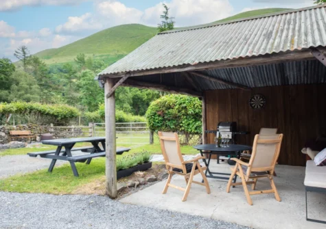 The covered patio, barbecue & alfresco dining area at Y Felin, Llanymawddwy