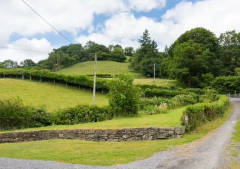 Surrounded by hills, mountains, woodland & wildlife, Y Felin is reached via a short private lane