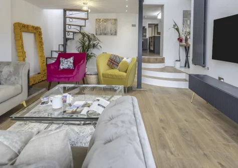 Y Llanw, Milford Haven is a beautifully renovated four-bedroom retreat on the peaceful edge of town, boasting estuary views, a private hot tub in the spacious garden, a games room, and contemporary interiors designed for groups and families.