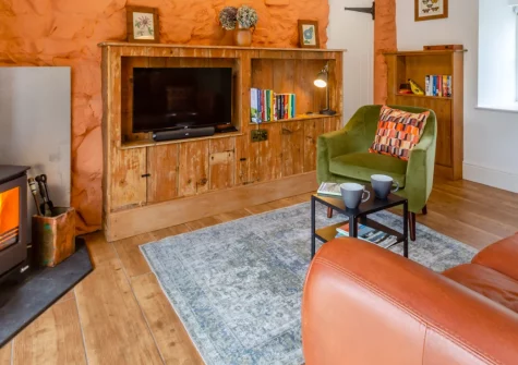 Yr Hen Ysgubor, Sarn Meyllteyrn is a stylish one-bedroom Welsh barn conversion on the Llŷn Peninsula. Enjoy a cosy wood burner, a starlit fire pit, sea and mountain views and an enclosed garden at a romantic, dog-friendly retreat for two.